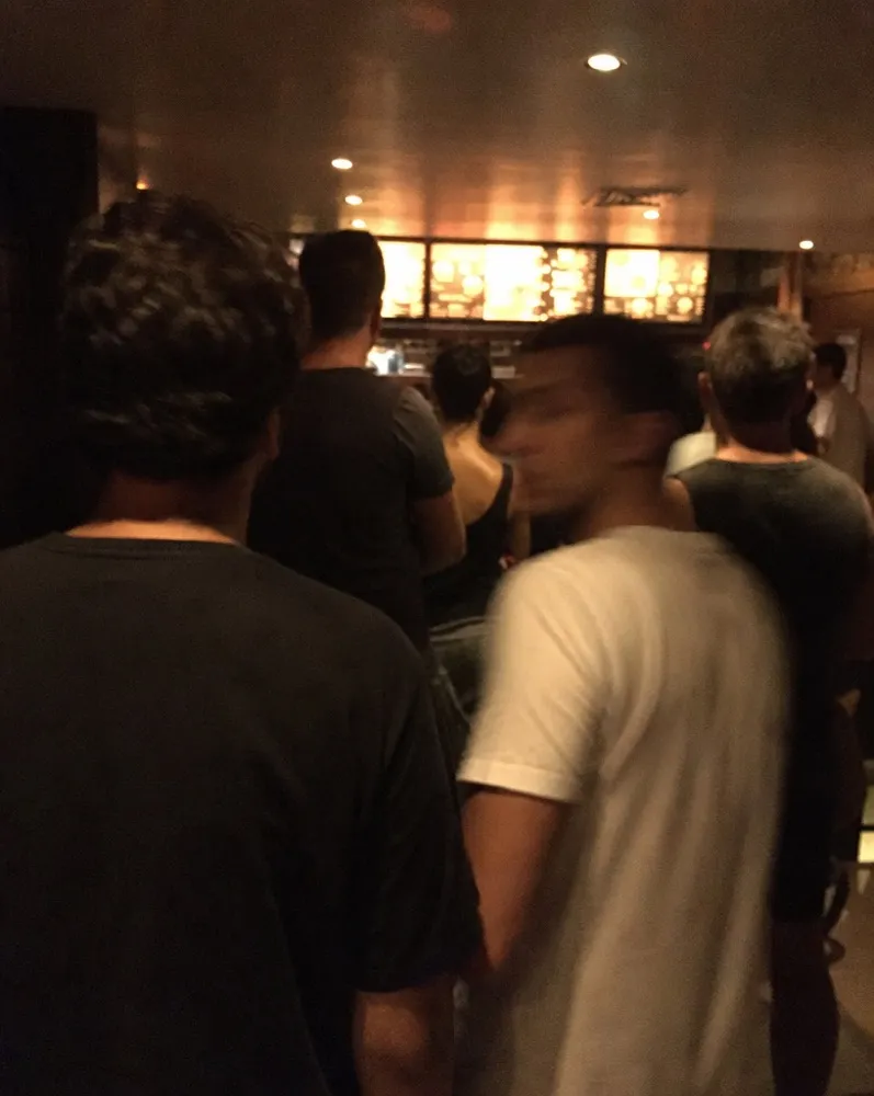 The back of the queue waiting to order at the counter